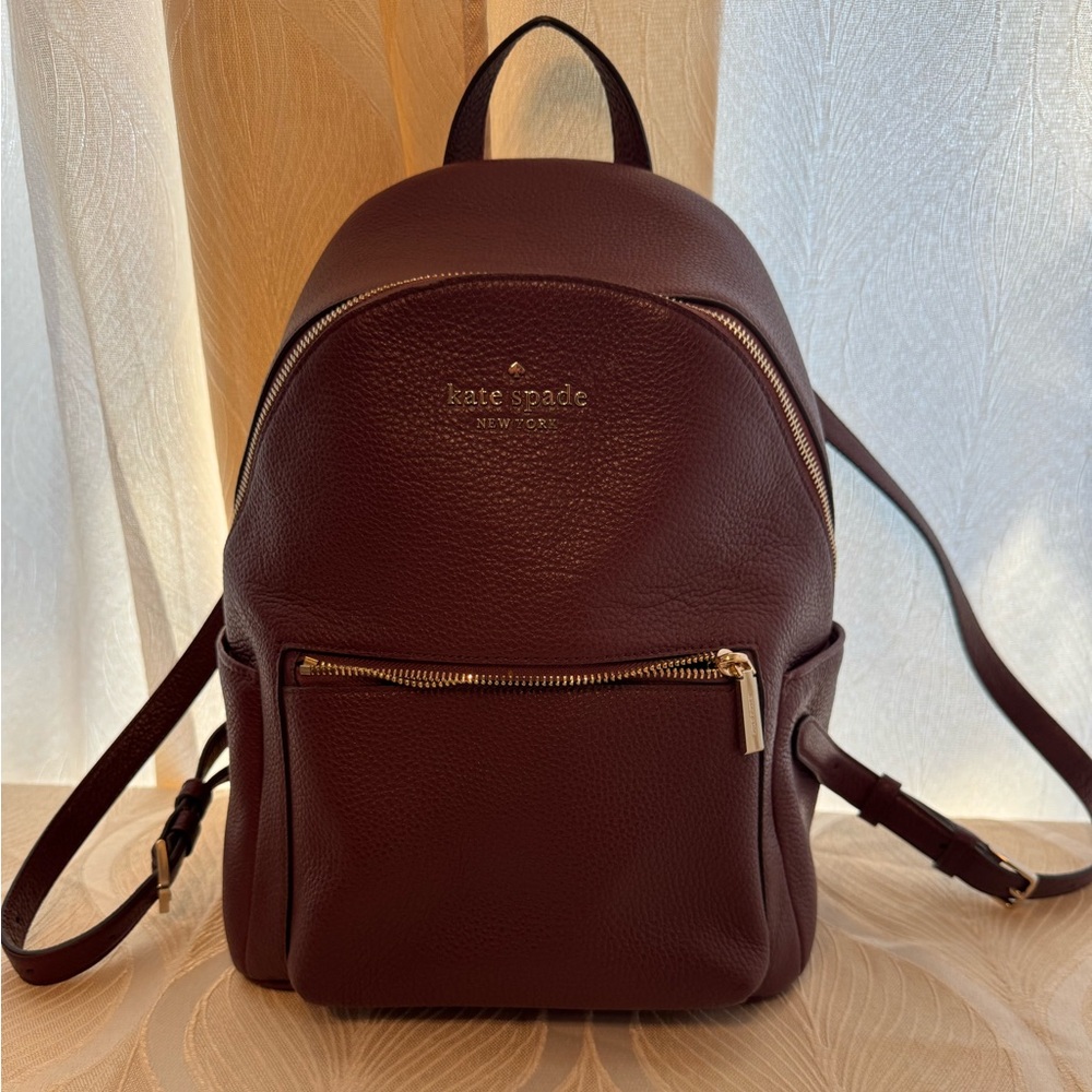 Kate Spade Mahogany Leather Backpack
No tag , but new never use